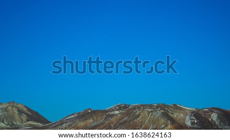 Textured Scenic Mountain Tips With Blue Sky In Bolivian Desert Minimal Photo