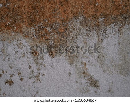 Rust marks on the walls of the white home