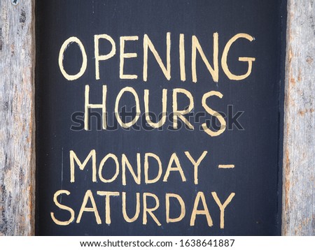 opening hours sign from Monday to Saturday