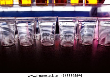 Plastic disposable glasses with water