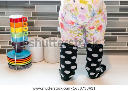 Polka dot socks floral pajamas and rainbow espresso cups