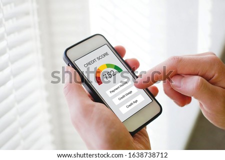 credit score concept on the screen of smart phone, checking payment history and ranking in bank online Royalty-Free Stock Photo #1638738712