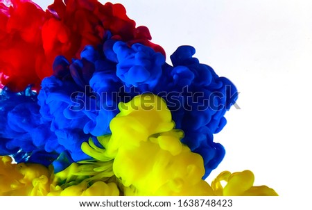Flag of Armenia made of colored ink on a white background. Blue, yellow and red watercolor ink in water. Stylish abstract modern background. A powerful explosion of colors. Cool trending screensaver.
