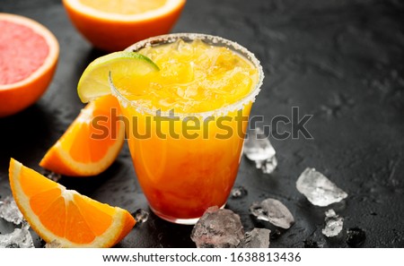 Refreshing summer alcoholic cocktail margarita with crushed ice and citrus fruits. Royalty-Free Stock Photo #1638813436