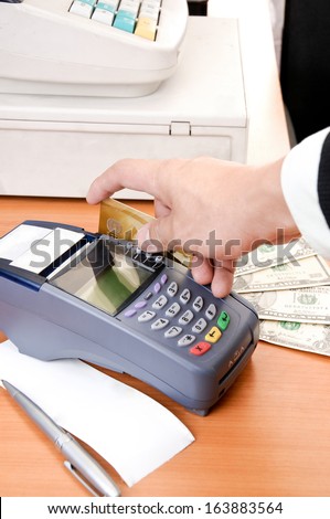 Close up Payment machine on during using Credit card from customer in shopping mall