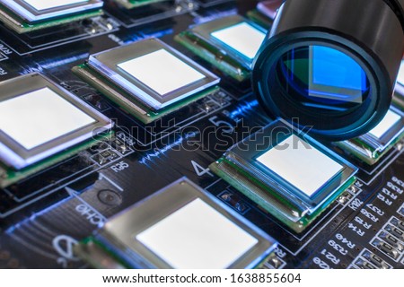 Test of checking several oled displays on the test station color analyzer. Displays glow brightly of white color.Microelecronics.Display and light panel technology. Royalty-Free Stock Photo #1638855604
