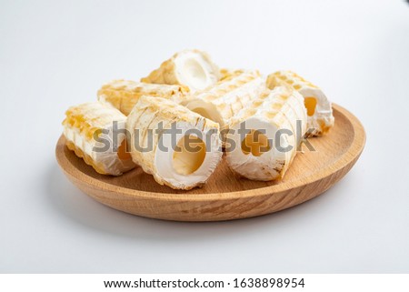 Shark bones dried on a saucer on white background	