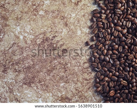 roasted coffee beans on wooden background.