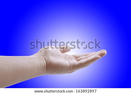 Man hand isolated on Blue background
