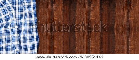 napkin tablecloth above wooden background
