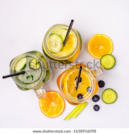 Glass Jars with Fresh Infused Water Made With Organic Fruits Vegetables and Berries Healthy Detox Drink Top View