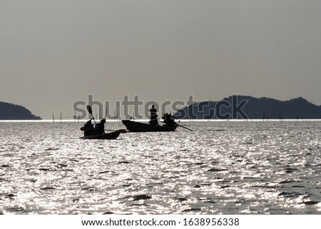 Travelers are rowing boat in the sea , Chantaburi province , Thailand silhouette picture