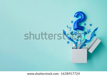 Number 2 birthday balloon celebration gift box lay flat explosion Royalty-Free Stock Photo #1638957724