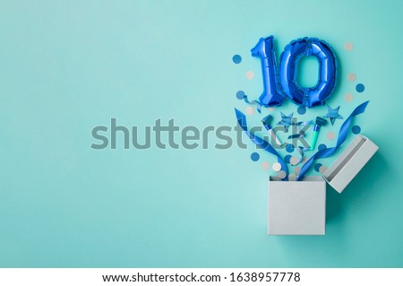 Number 10 birthday balloon celebration gift box lay flat explosion Royalty-Free Stock Photo #1638957778