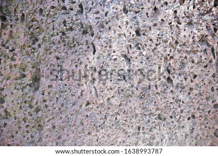 The surface of laterite stone of the old wall. original color style.