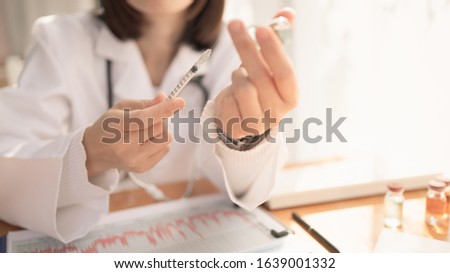 Syringe, medical injection in hand, palm or fingers. Medicine plastic vaccination equipment with needle. Nurse or doctor. Liquid drug or narcotic. Health care in hospital