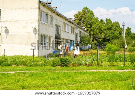 old country house in Russian village with linen drying on the street