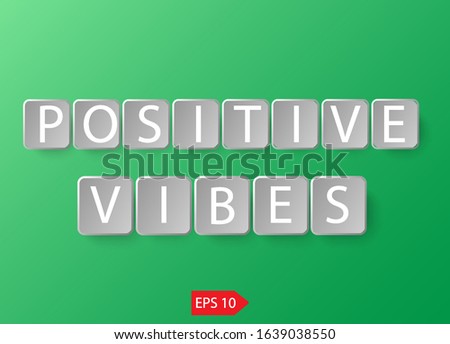 Positive vibes cubes on green background.