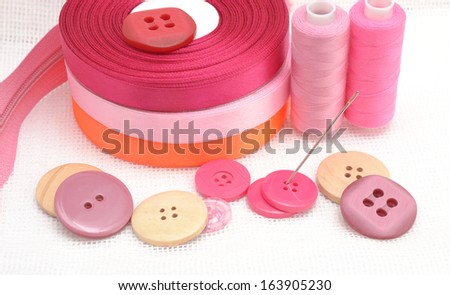 Sewing set on fabric background.
