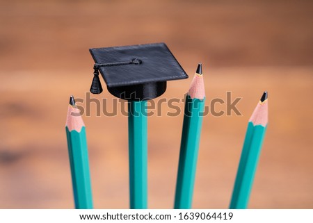 Photo Of College Graduation Hat On Pencil