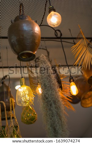 Antique electric lamp Architectural design that is very beautiful Installed in a coffee shop Use a variety of materials including metal and glass. - stock photo