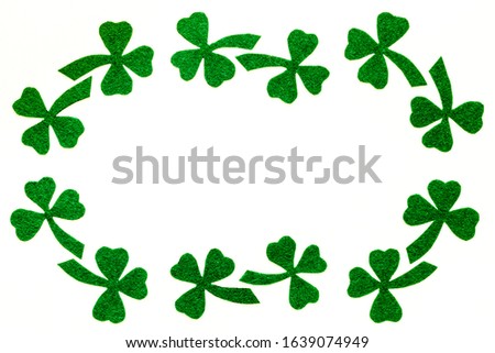 St.Patrick 's Day. Day of rest.  Composition of green clover leaves.
White background top view,flat lay, mockup