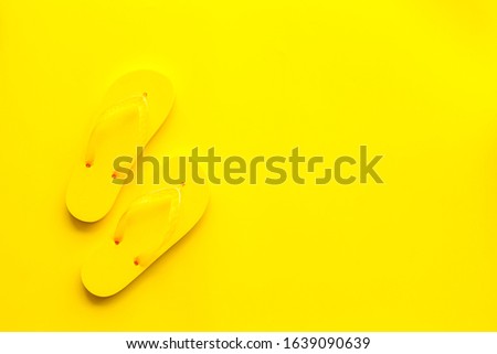 Yellow Flip-flops.
Yellow background top view,flat lay, mockup