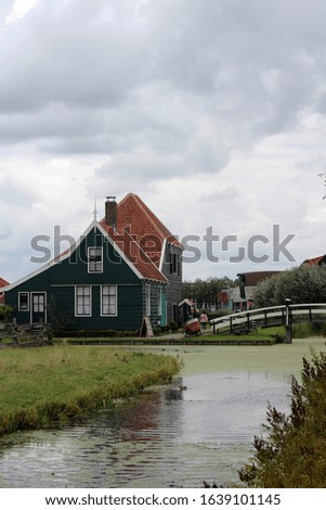 Dutch house on a river. Summer photo. 