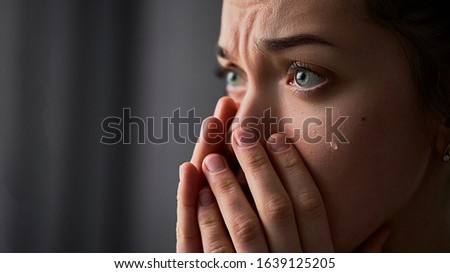 Sad desperate crying woman with folded hands and tears eyes during trouble, life difficulties, loss and emotional problems Royalty-Free Stock Photo #1639125205