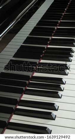 Piano with it keys and reflection. 