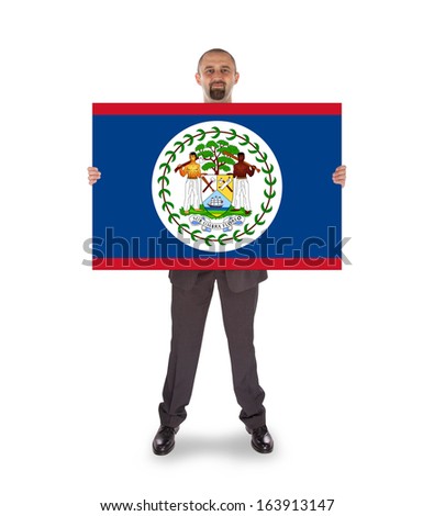 Smiling businessman holding a big card, flag of Belize