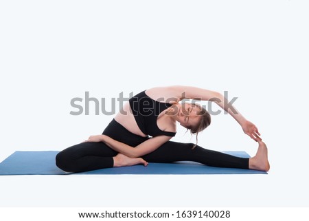 photo of woman in studiou practicing yoga over white background