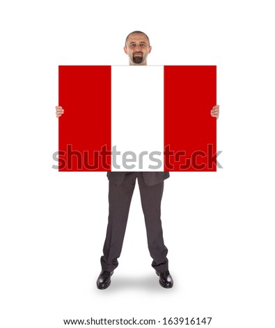 Smiling businessman holding a big card, flag of Peru