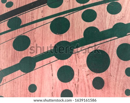 Green circles and lines on wood background