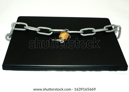 protected laptop with chain and padlock symbol for safety