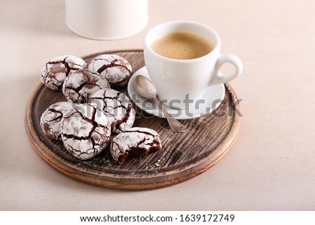 Chocolate fudge crinkle biscuits with cup of coffee