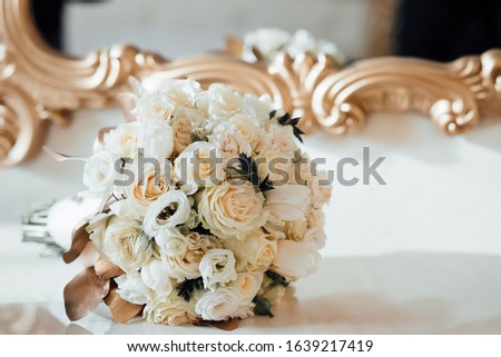 Beautiful modern wedding bouquet on white table. Close up of wedding bouquet