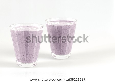 smoothie with blueberries and oatmeal is on the table