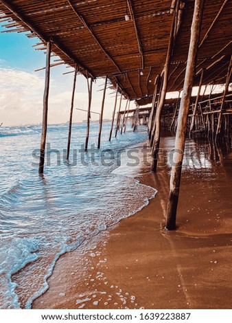 Seascape, sea view from under the bamboo roof. Travel Asia