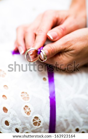wife holding a gold ring