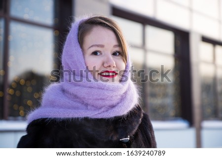 portrait of happy young woman in winter. cold winter 