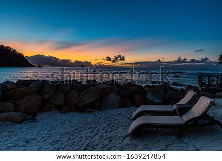 Sunset on Beach by the Ocean