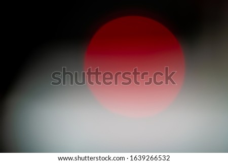 red circle on black and white background