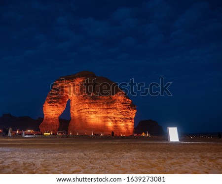 Tourists gather at the Elephant Rock geological site near Al Ula, Saudi Arabia. Royalty-Free Stock Photo #1639273081