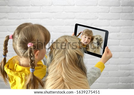 kid child a dog making selfies with