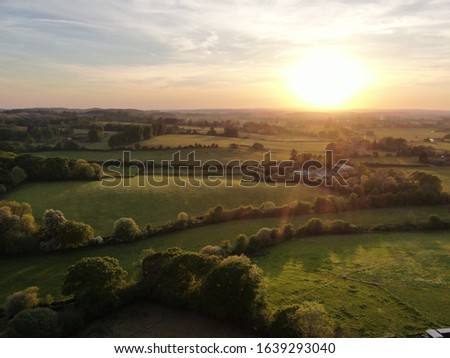 lovely rolling countryside seen in warm evening light aerial drone shot