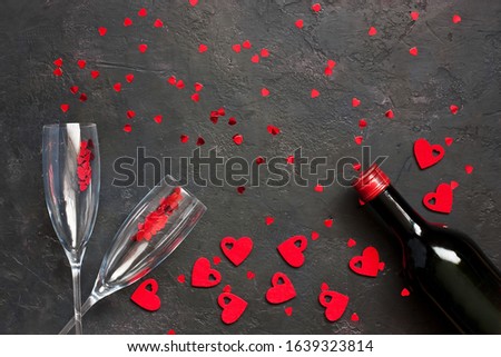 Valentines day  concept. Wine bottle  and glasses  on color background with copy space for text, top view