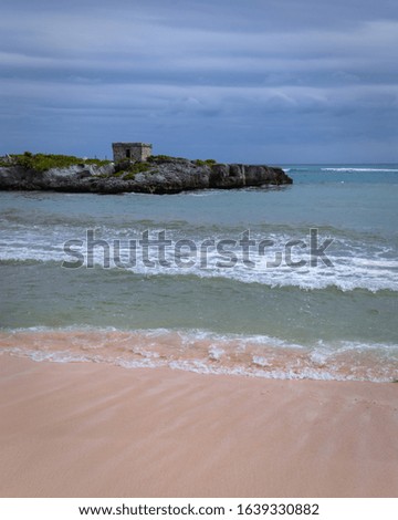 Ancient house on rocks and beach