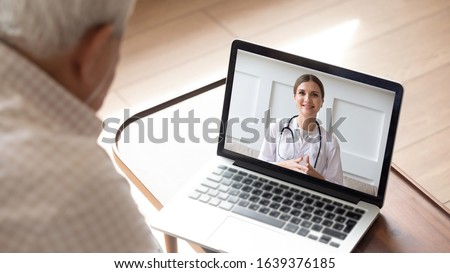 Close up of modern elderly man sit at home having online consultation with doctor on computer, sick senior male talk on video call consulting with female nurse using laptop, healthcare concept Royalty-Free Stock Photo #1639376185