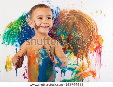 adorable kid paint stained representing the creativity and the freedom